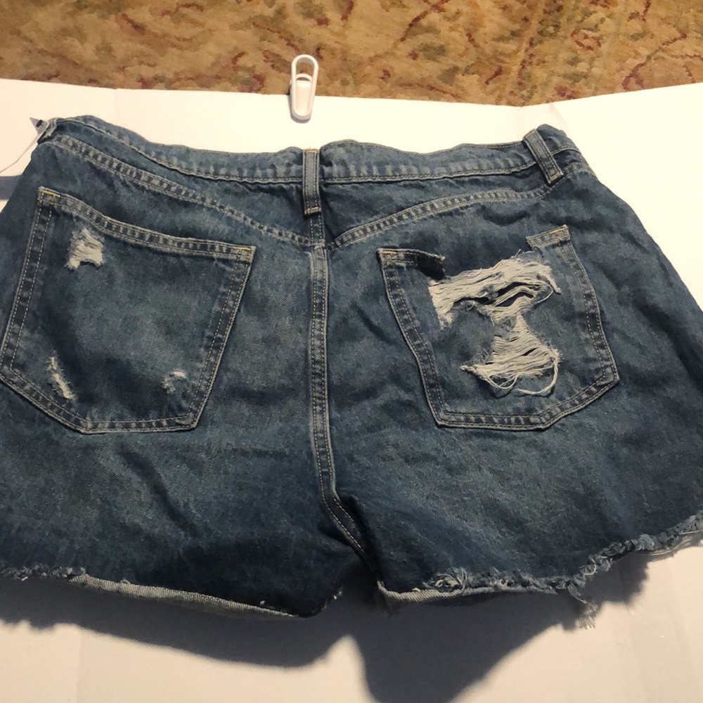 Woman’s distressed high rise button fly Jean shorts - Picture 7 of 9